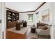 Office featuring hardwood floors, built-in bookshelves, and a large window offering natural light at 5818 Cruiser Way, Tampa, FL 33615