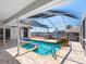 Backyard pool and spa with lanai and waterfall, overlooking waterfront views at 5818 Cruiser Way, Tampa, FL 33615