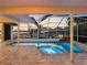 Backyard pool and spa with lanai and waterfall, captured at dusk at 5818 Cruiser Way, Tampa, FL 33615