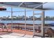 Inviting screened porch overlooks serene water with boat dock, offering a relaxing outdoor space at 5818 Cruiser Way, Tampa, FL 33615
