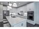 Sleek kitchen with modern appliances, a large island, and stylish white cabinetry at 5949 Bluestar Ct, Lakewood Ranch, FL 34211