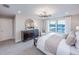 Bright and airy main bedroom with a stylish dresser, views of the water, and neutral tones at 5949 Bluestar Ct, Lakewood Ranch, FL 34211