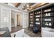 Office features a bookshelf with ladder and bright lighting at 5949 Bluestar Ct, Lakewood Ranch, FL 34211