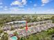 Bird's eye view showing the property's proximity to nearby ponds and local surroundings at 612 Ozona Village Dr, Palm Harbor, FL 34683