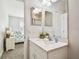 Bright and modern bathroom featuring a sleek vanity with stylish fixtures and ample natural light at 612 Ozona Village Dr, Palm Harbor, FL 34683