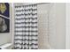 Bathroom featuring a subway tile shower surround and a blue and white striped shower curtain at 612 Ozona Village Dr, Palm Harbor, FL 34683