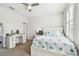 Relaxing bedroom with coastal decor, ceiling fan, and shuttered window provides a serene retreat at 612 Ozona Village Dr, Palm Harbor, FL 34683