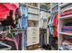 Walk-in closet with ample shelving, hanging rods, drawers, and storage bins creates an organized and spacious storage solution at 612 Ozona Village Dr, Palm Harbor, FL 34683
