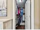 Organized walk-in closet offers ample storage with built-in shelving and hanging rods, maximizing space efficiently at 612 Ozona Village Dr, Palm Harbor, FL 34683