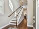 Bright foyer with hardwood floors and stairs leading to the second level at 612 Ozona Village Dr, Palm Harbor, FL 34683