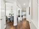 Hallway view into the dining room and living areas of the home at 612 Ozona Village Dr, Palm Harbor, FL 34683