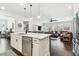 Modern kitchen with island that opens to the living room; great for entertaining and Gathering time at 612 Ozona Village Dr, Palm Harbor, FL 34683