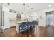 Gourmet kitchen featuring a large island with bar seating, stainless appliances and pendant lighting at 612 Ozona Village Dr, Palm Harbor, FL 34683