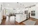 Spacious open-concept kitchen with stainless appliances, island, and easy access to the living room at 612 Ozona Village Dr, Palm Harbor, FL 34683