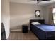 Comfortable bedroom with wood-look floors, ceiling fan, and neutral wall color at 620 Lithia Pinecrest Rd, Brandon, FL 33511