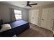 Cozy bedroom with natural light, wood-look floors, and neutral wall color at 620 Lithia Pinecrest Rd, Brandon, FL 33511