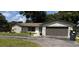 Charming single-story home featuring a two-car garage and well-maintained lawn at 620 Lithia Pinecrest Rd, Brandon, FL 33511