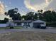 Charming one-story home featuring a stone-accented facade, a well-manicured lawn and an expansive driveway at 620 Lithia Pinecrest Rd, Brandon, FL 33511