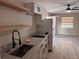 Contemporary kitchen with granite countertops, modern fixtures, and an adjacent open-concept living area at 620 Lithia Pinecrest Rd, Brandon, FL 33511