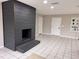 Open living room featuring a modern fireplace and neutral color scheme, perfect for relaxation and entertainment at 620 Lithia Pinecrest Rd, Brandon, FL 33511