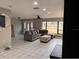 Inviting living area with a sectional sofa, bright windows, tile flooring, and an open layout for versatile living at 620 Lithia Pinecrest Rd, Brandon, FL 33511