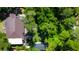 An aerial view shows the home, green lawns, and mature trees surrounding the property at 6341 Discovery Ln, Land O Lakes, FL 34638