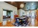 Spacious dining area open to living room with stylish decor and hardwood floors at 6341 Discovery Ln, Land O Lakes, FL 34638