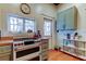 Well-lit kitchen showcasing butcher block countertops, double oven, ample storage, and natural light from the window and door at 6341 Discovery Ln, Land O Lakes, FL 34638