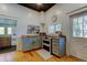 Charming kitchen with light blue cabinetry, wooden countertop, double-door oven and natural light, blending style and functionality at 6341 Discovery Ln, Land O Lakes, FL 34638
