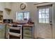 Bright kitchen featuring double oven, butcher block countertops, and a window overlooking the backyard at 6341 Discovery Ln, Land O Lakes, FL 34638
