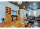 Stylish living room with hardwood floors, custom built-ins, and elegant lighting at 6341 Discovery Ln, Land O Lakes, FL 34638