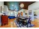 Spacious living room boasts hardwood floors, high ceilings, modern lighting, and stylish decor at 6341 Discovery Ln, Land O Lakes, FL 34638