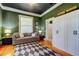 Stylish living room with hardwood floors, neutral sofa, and built-in storage at 6341 Discovery Ln, Land O Lakes, FL 34638