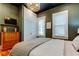 Comfortable main bedroom features a modern light fixture, and lots of closet space and storage at 6341 Discovery Ln, Land O Lakes, FL 34638