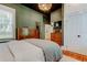 Well-lit main bedroom featuring two dressers and ample closet space, with ensuite bathroom entrance at 6341 Discovery Ln, Land O Lakes, FL 34638
