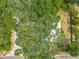 The house has a large area with plenty of trees surrounding it near a road at 6901 N 19Th St, Tampa, FL 33610