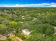 An aerial view showing houses surrounded by trees in a neighborhood in the city at 6901 N 19Th St, Tampa, FL 33610