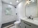 Beautifully renovated bathroom with modern fixtures, stylish tile work, and a walk-in shower at 6901 N 19Th St, Tampa, FL 33610