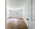 Well-lit bedroom with wood-look floors and two windows, providing natural light at 6901 N 19Th St, Tampa, FL 33610