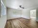 Serene bedroom featuring hardwood floors, white trim, and ample natural light creating a relaxing retreat at 6901 N 19Th St, Tampa, FL 33610