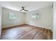 Bright bedroom with hardwood floors and two large windows offering ample natural light at 6901 N 19Th St, Tampa, FL 33610