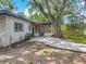 A beautifully renovated house with modern updates and an inviting, oversized front yard and mature trees at 6901 N 19Th St, Tampa, FL 33610