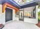 Inviting front porch with dark accents that add charm and character to the home's exterior at 6901 N 19Th St, Tampa, FL 33610
