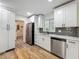 Beautifully renovated kitchen with modern stainless-steel appliances and white cabinets at 6901 N 19Th St, Tampa, FL 33610