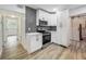 Bright kitchen with stainless steel oven and microwave, along with white countertops and cabinets at 6901 N 19Th St, Tampa, FL 33610