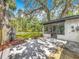 Back patio with view into the sunroom at 6901 N 19Th St, Tampa, FL 33610