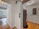 Functional utility area featuring a water heater and a white sliding barn door at 6901 N 19Th St, Tampa, FL 33610