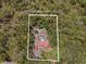 Aerial view of 7095 South St Webster, FL 33597, featuring home and lush trees with GPS coordinates at 7095 South St, Webster, FL 33597