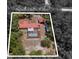 Aerial view of 7095 South St Webster, FL 33597, featuring home and lush trees with GPS address at 7095 South St, Webster, FL 33597