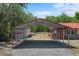 View of a large carport and storage area, connected to the main residence at 7095 South St, Webster, FL 33597